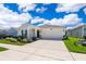 Inviting single-Gathering home with a spacious driveway and a neatly kept front lawn at 1959 Cricket Cradle Dr, Kissimmee, FL 34746