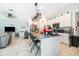 Spacious kitchen featuring an island with seating and views into the living area at 1959 Cricket Cradle Dr, Kissimmee, FL 34746