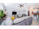 Open-concept living room with a view of the kitchen and stainless steel refrigerator at 1959 Cricket Cradle Dr, Kissimmee, FL 34746