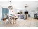 Cozy living and dining area with tile floors and plenty of natural light at 1959 Cricket Cradle Dr, Kissimmee, FL 34746