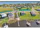 Aerial view showcasing lakefront homes and a community pool with lake access at 224 Valencia Ridge Dr, Auburndale, FL 33823
