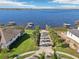 Aerial view showing lakefront homes with boat docks and stunning waterfront access at 224 Valencia Ridge Dr, Auburndale, FL 33823
