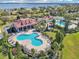 An aerial view of the clubhouse and pool surrounded by lush landscaping at 224 Valencia Ridge Dr, Auburndale, FL 33823
