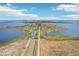 Expansive aerial view showcasing the community surrounded by two large lakes at 224 Valencia Ridge Dr, Auburndale, FL 33823