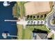 Aerial view of property with lake access, private dock and well-manicured landscaping at 224 Valencia Ridge Dr, Auburndale, FL 33823