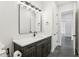 Bathroom featuring a vanity with dark wood cabinets, bright lighting and fixtures at 224 Valencia Ridge Dr, Auburndale, FL 33823