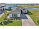 An up close front exterior view of a gorgeous home with meticulously landscaped front yard at 224 Valencia Ridge Dr, Auburndale, FL 33823