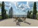 Scenic fire pit area with chairs and lake views, ideal for outdoor entertaining at 224 Valencia Ridge Dr, Auburndale, FL 33823