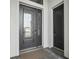 A gorgeous ornate glass front door and sidelight with a slate tile entrance at 224 Valencia Ridge Dr, Auburndale, FL 33823