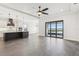 The spacious kitchen features modern appliances, an island with bar seating and lake view sliding glass doors at 224 Valencia Ridge Dr, Auburndale, FL 33823