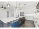 Open concept kitchen with a large center island, stainless steel appliances, and modern pendant lighting at 224 Valencia Ridge Dr, Auburndale, FL 33823