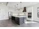 The spacious kitchen features modern appliances, an island with bar seating, and modern fixtures at 224 Valencia Ridge Dr, Auburndale, FL 33823
