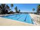 Bright swimming pool featuring lap lanes and lounge chairs, perfect for relaxation and exercise at 224 Valencia Ridge Dr, Auburndale, FL 33823