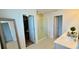 Bright bathroom featuring a glass-enclosed shower, modern vanity, and a walk-in closet at 2508 W End Dr, St Cloud, FL 34772