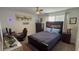 Comfortable bedroom featuring a full-size bed, ceiling fan, and themed decor at 2508 W End Dr, St Cloud, FL 34772