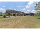 View of the backyard showing the pool and screened in area at 256 Yellow Snapdragon Dr, Davenport, FL 33837