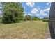 Backyard with grass and wooded area at 256 Yellow Snapdragon Dr, Davenport, FL 33837