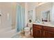 Bathroom with a shower-tub combination, single vanity, and tile flooring at 256 Yellow Snapdragon Dr, Davenport, FL 33837
