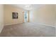 Large bedroom with neutral walls, carpet flooring and abundant natural light at 256 Yellow Snapdragon Dr, Davenport, FL 33837