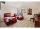 Inviting bedroom with two twin beds, charming decor, and a relaxing atmosphere at 256 Yellow Snapdragon Dr, Davenport, FL 33837