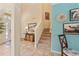 Welcoming foyer with staircase, light tile flooring, and an abundance of natural light at 256 Yellow Snapdragon Dr, Davenport, FL 33837