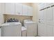 Laundry room with washer, dryer, and cabinets at 256 Yellow Snapdragon Dr, Davenport, FL 33837