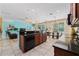 Open floor plan features eat in kitchen, dining area, living room, tile floors and updated cabinets at 256 Yellow Snapdragon Dr, Davenport, FL 33837