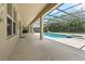 Screened in pool area including a in ground pool, hot tub, and covered area at 256 Yellow Snapdragon Dr, Davenport, FL 33837