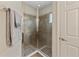 Walk-in shower features glass enclosure and neutral tile at 256 Yellow Snapdragon Dr, Davenport, FL 33837