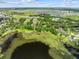 Overhead aerial view showcasing the property's location near a lake and surrounding community amenities at 2571 Ames Haven Rd, Kissimmee, FL 34744