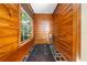 Cozy bathroom featuring a wood-paneled soaking tub and a window at 2571 Ames Haven Rd, Kissimmee, FL 34744