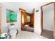 Bathroom showing toilet and art on wall, plus a view of the soaking tub at 2571 Ames Haven Rd, Kissimmee, FL 34744