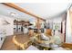 Charming dining area with hardwood floors next to kitchen and living spaces, complemented by natural light at 2571 Ames Haven Rd, Kissimmee, FL 34744