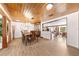 Formal dining room with wooden floors and a view into the kitchen at 2571 Ames Haven Rd, Kissimmee, FL 34744