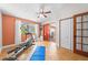 Well-lit exercise room equipped with an elliptical machine, fan, and access to an outdoor area at 2571 Ames Haven Rd, Kissimmee, FL 34744