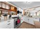 Well-equipped kitchen with modern appliances, granite countertops, and hardwood floors, perfect for culinary enthusiasts at 2571 Ames Haven Rd, Kissimmee, FL 34744