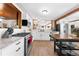 Modern kitchen with stainless steel appliances, granite countertops, and hardwood floors, ideal for cooking and entertaining at 2571 Ames Haven Rd, Kissimmee, FL 34744