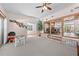 Open living area with brick accents, a play area, and seamless transition to the dining room at 2571 Ames Haven Rd, Kissimmee, FL 34744