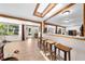 Inviting living room with a skylight, wooden beams, bar seating and an open floor plan perfect for entertaining at 2571 Ames Haven Rd, Kissimmee, FL 34744