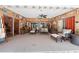 Inviting sunroom featuring comfortable seating, wood paneling, and decorative nautical-themed accents for relaxation at 2571 Ames Haven Rd, Kissimmee, FL 34744