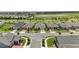 Scenic aerial view of a residential community featuring well-maintained homes and a tranquil lake at 2621 Redblush Ter, St Cloud, FL 34772