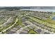 High-angle view of a neighborhood with multiple ponds and water features throughout the community at 2621 Redblush Ter, St Cloud, FL 34772