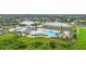 Aerial view of an amazing community clubhouse with a pool and state of the art amenities at 2621 Redblush Ter, St Cloud, FL 34772