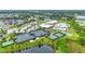 Active community featuring multiple tennis courts, lush landscaping, clubhouse, and pool in a park-like setting at 2621 Redblush Ter, St Cloud, FL 34772