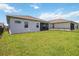This lovely home has a large grass backyard with a screened in patio at 2621 Redblush Ter, St Cloud, FL 34772