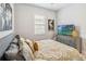 Comfortable bedroom with a window letting in natural light at 2621 Redblush Ter, St Cloud, FL 34772