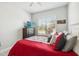 Bright bedroom with a large window and neutral tones at 2621 Redblush Ter, St Cloud, FL 34772