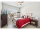 Bright bedroom with a large window and neutral tones at 2621 Redblush Ter, St Cloud, FL 34772
