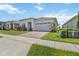 Well-kept single Gathering home features a brick paver driveway and attached two-car garage at 2621 Redblush Ter, St Cloud, FL 34772