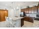 Modern kitchen features stainless steel appliances, granite countertops, and ample cabinet space at 2621 Redblush Ter, St Cloud, FL 34772